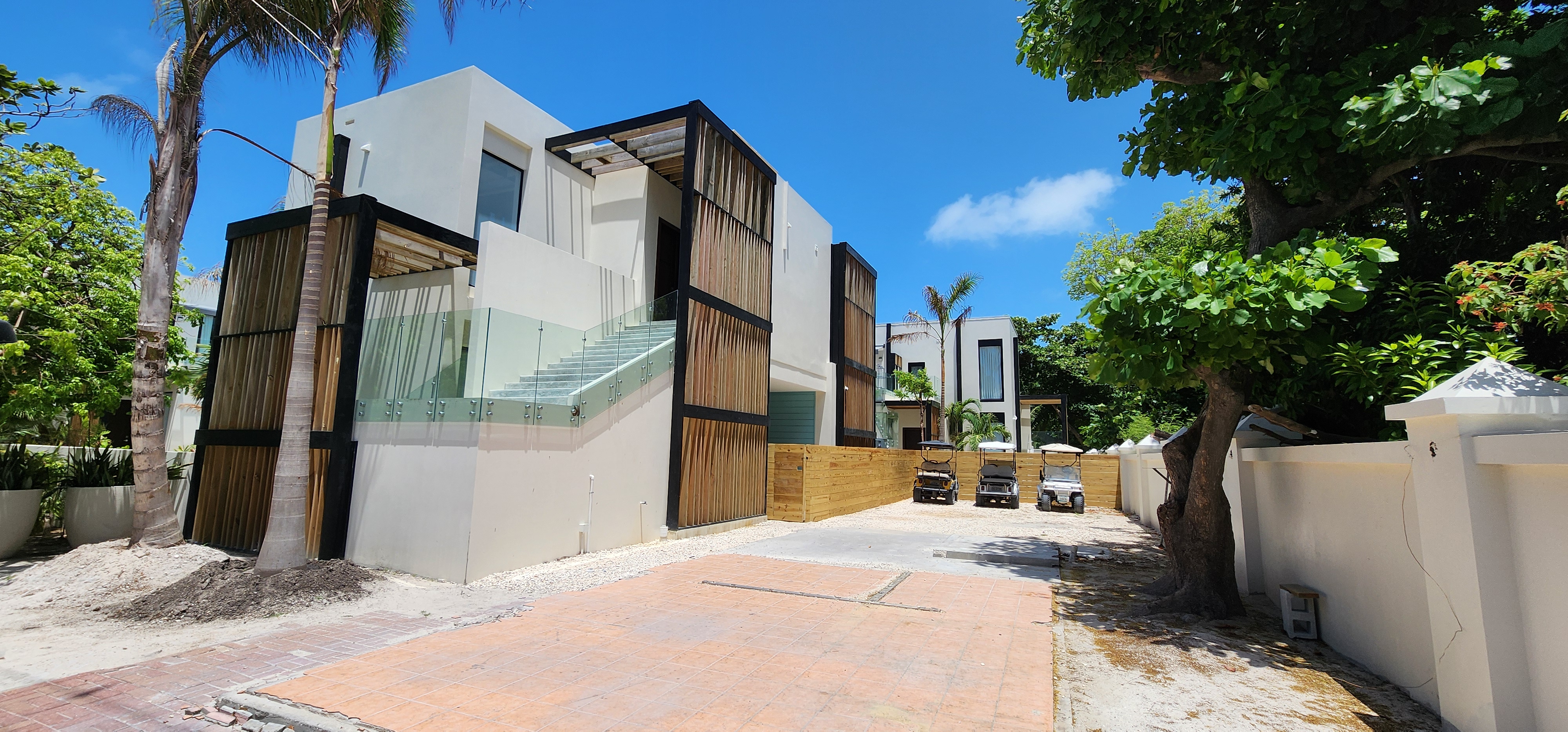 Modern coastal home with mahogany louvered panels in Belize
